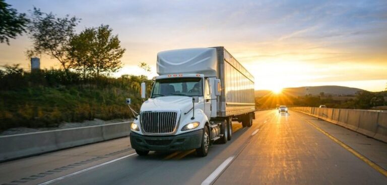 Moving truck driving on highway