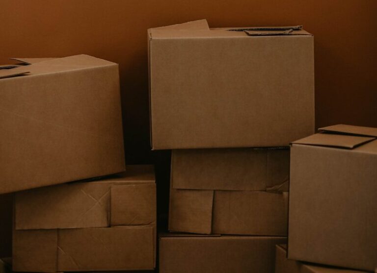 white cardboard box on brown wooden table